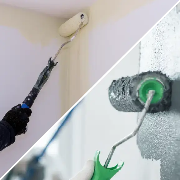Eine Wand mit einer Farbrolle streichen.
