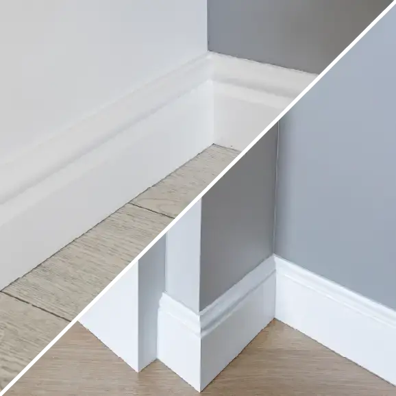 Weiße Fußleisten, die am Übergang zwischen Boden und Wand angebracht sind.